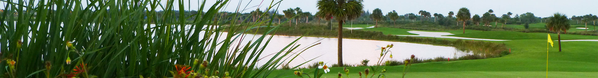 outside golf course shot with lake and flag